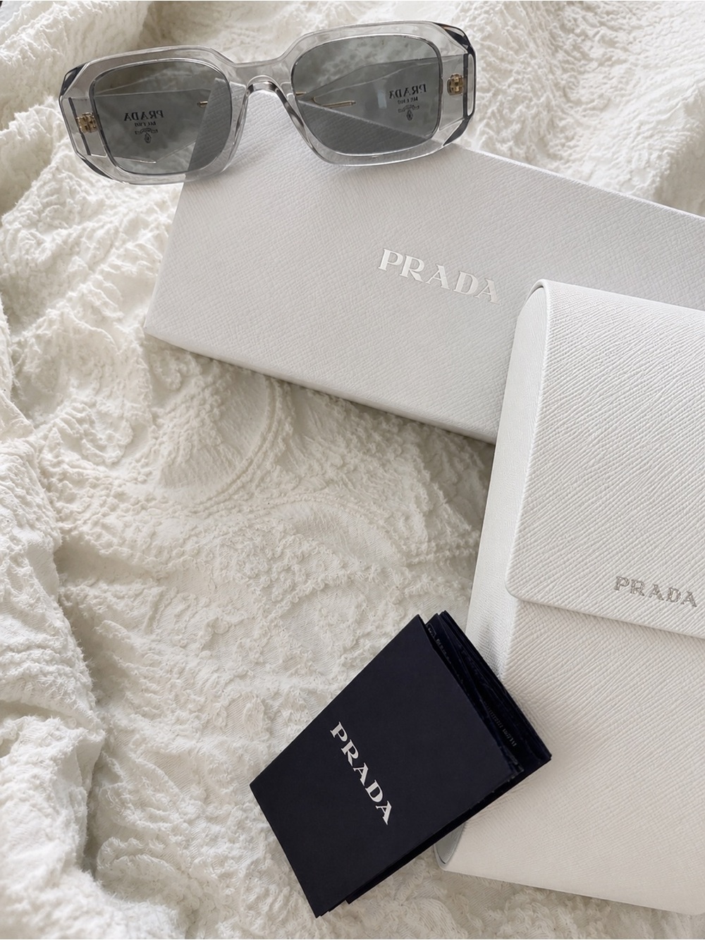Prada Transparent Grey Rectangular Sunglasses with Gold Accents
